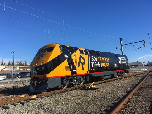 Amtrak locomotive with Operation Lifesaver 50th anniversary logo