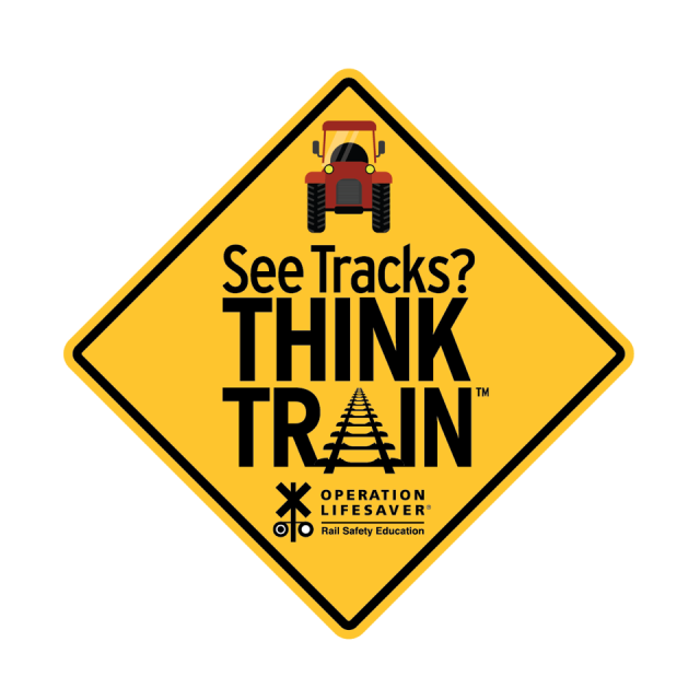 an image of a tractor with the slogan see tracks think train