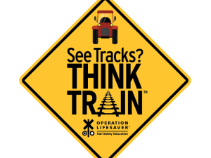 an image of a tractor with the slogan see tracks think train
