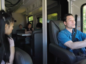 Man driving an RV with his family