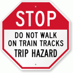 a sign warning people not to walk on tracks