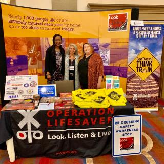 oli staff at a conference booth