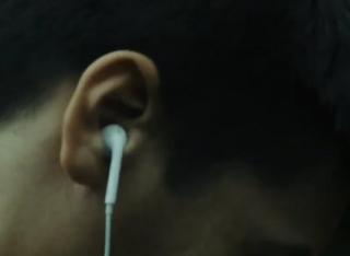 an image of a man's head with earbuds