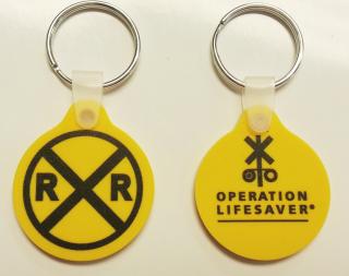 yellow keychain with OLI logo