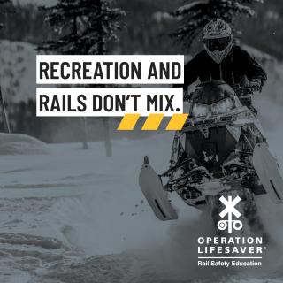 a snowmobiler in black and white with a rail safety slogan