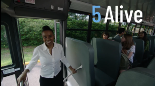 an image of a woman boarding a school bus