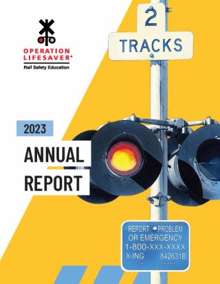 a report cover in yellow and white with a logo and close up of a railroad crossing signal